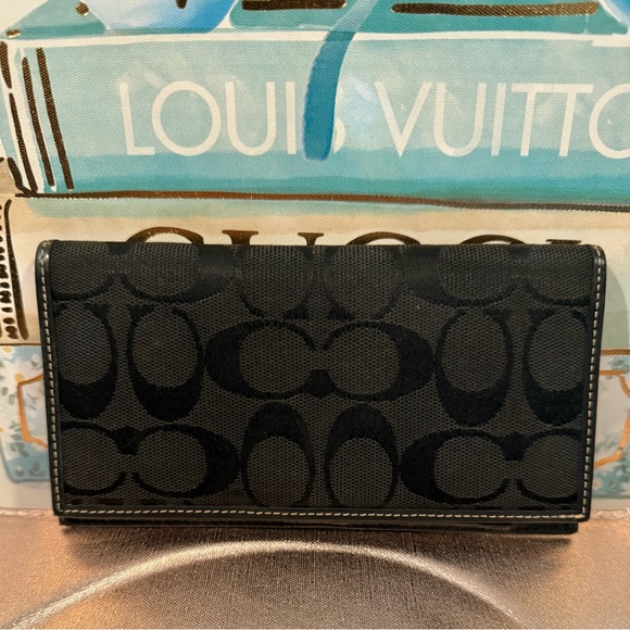 Black monogrammed canvas Coach wallet with black leather interior and pen holder - Picture 1 of 4